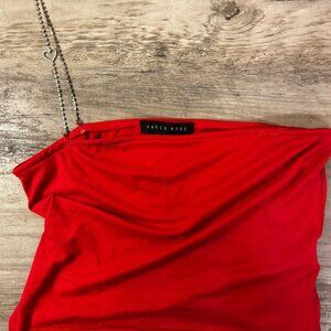Red off the shoulder shirt. With a rhinestone strap on one side